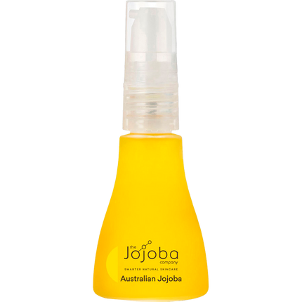 Woman applying Australian jojoba oil on face for natural moisturising and glow