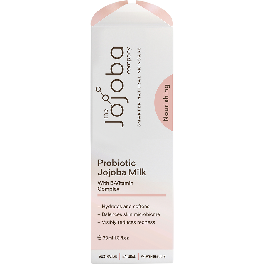 Woman applying probiotic jojoba milk with B vitamin complex for hydrated glowing skin