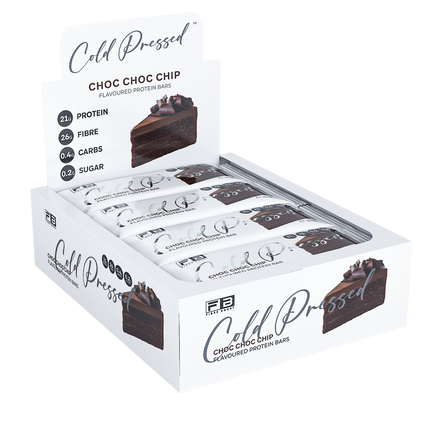 Box of Cold Pressed Choc Choc Chip protein bars with a slice of chocolate cake on a white background