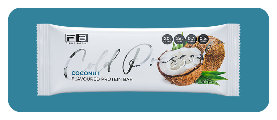 Coconut flavored protein bar packaging on a teal background