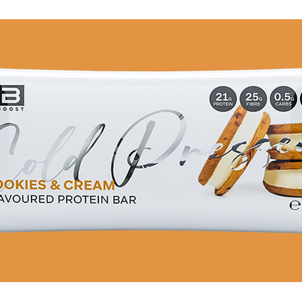 Cookies & Cream flavored protein bar packaging on an orange background