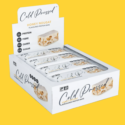 Box of Fibre Boost Cold Pressed Honey Nougat Protein Bar on a white background