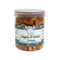 Jar of jaggery and coconut cashews with a label on a white background
