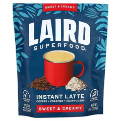 Laird Superfood Instant Latte package with a red cup and coffee beans on a blue background