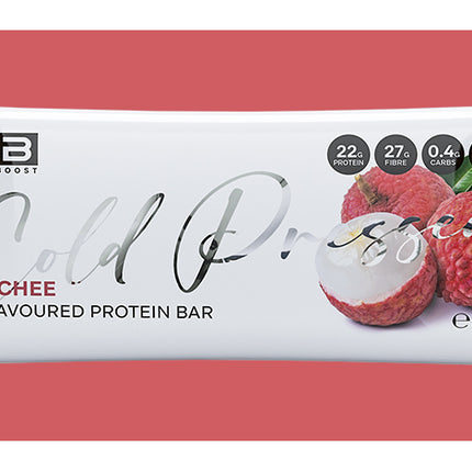 Lychee-flavored protein bar packaging on a red background