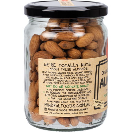Organic activated almonds on rustic wooden table