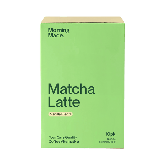 Green box of Matcha Latte Vanilla Blend coffee alternative on a green background