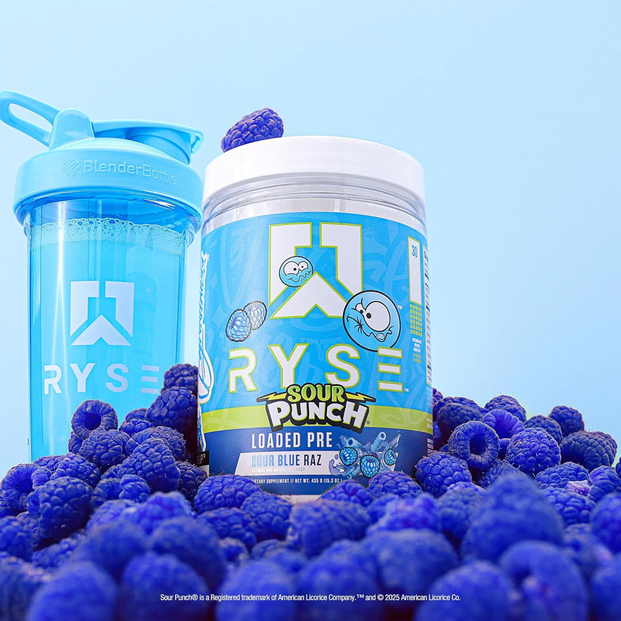 Ryse Sour Punch Loaded Pre supplement container with blueberries on a light blue background