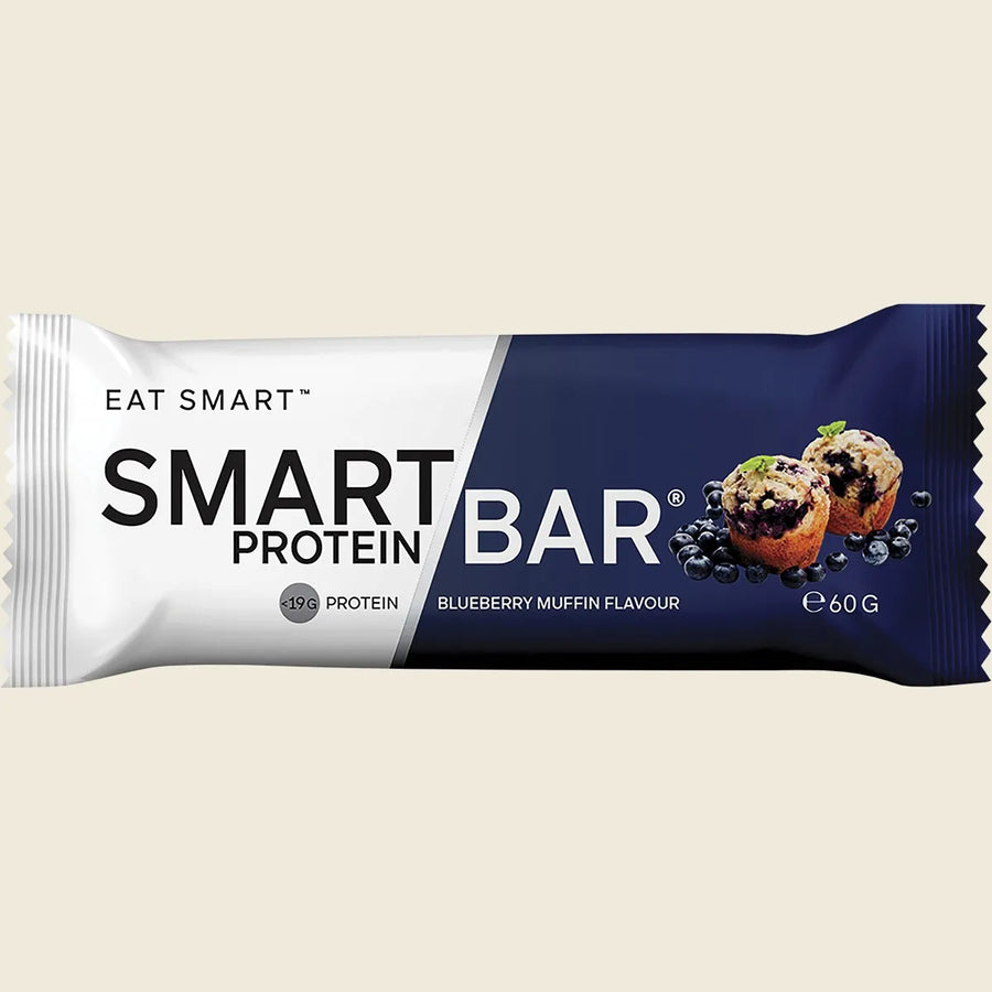 Smart Protein Bar packaging with blueberry muffin flavor on a beige background