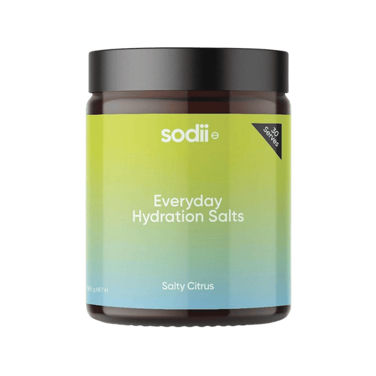 Jar of 'Everyday Hydration Salts' by sodii on a gradient green and blue background