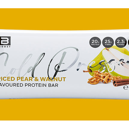 Fibre Boost Spiced Pear & Walnut protein bar packaging on a yellow background