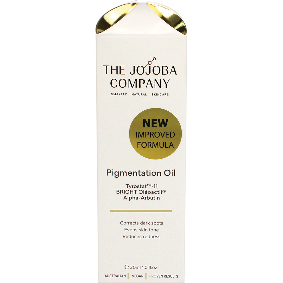 Woman applying The Jojoba Company Pigmentation Oil to reduce pigmentation and brighten skin