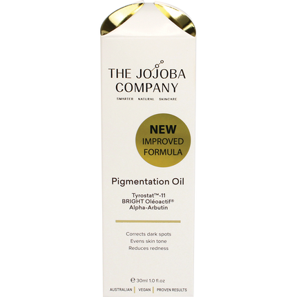 Woman applying The Jojoba Company Pigmentation Oil to reduce pigmentation and brighten skin