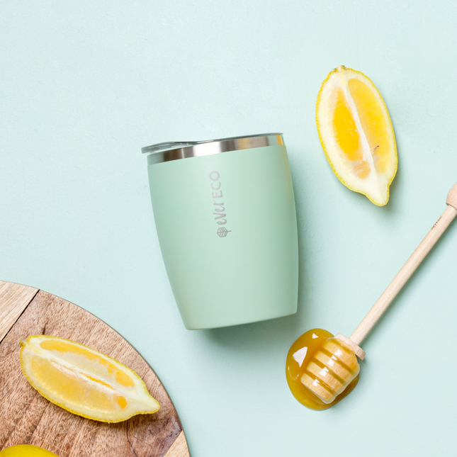 Ever Eco Sage 295ml insulated coffee cup styled with lemon and honey