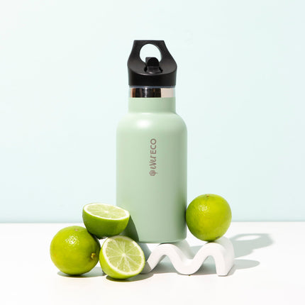 Ever Eco Sage 350ml insulated bottle with sip lid styled with limes