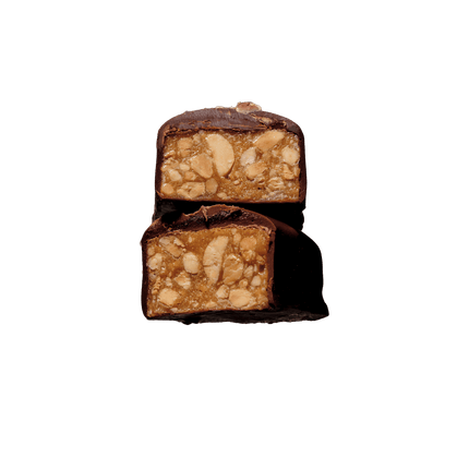 Cut-open chocolate bar showing crunchy peanut butter and chewy caramel centre