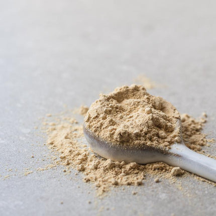 Power Super Foods maca powder served on a spoon